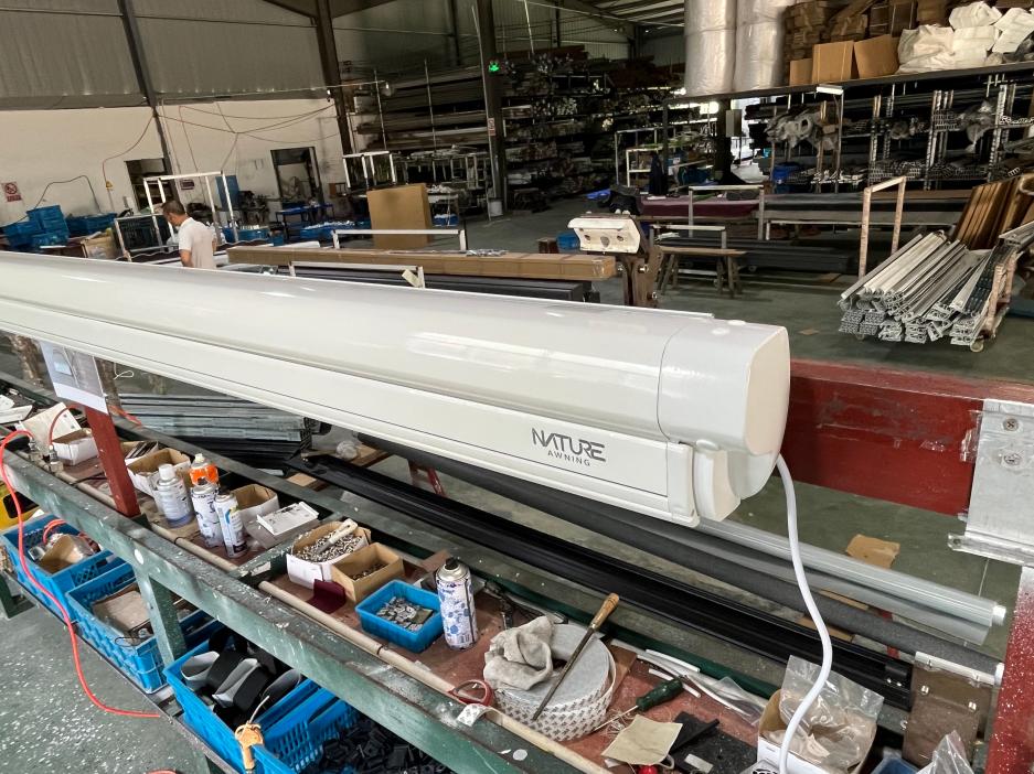 NATURE AWNING wall-mounted RV awning during factory assembly